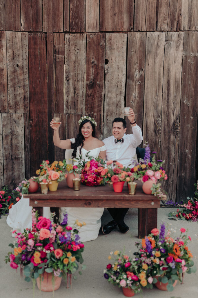 colorful sweetheat table with bride and groom